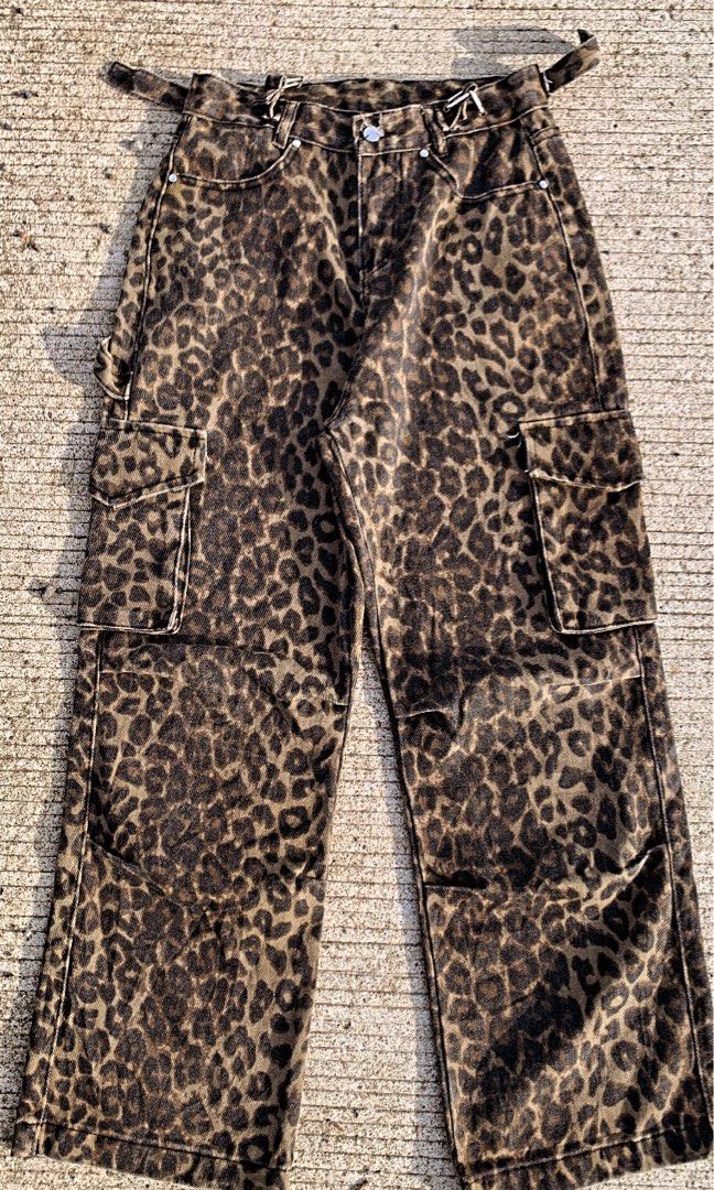 Leopard print cargo pants wide leg denim (Category: Jeans) located in Iloilo. Submitted by johnpullan30303 (Listing ID 1467610858, Image 1). Description: - Style: Wild leopard print wide leg cargo pants / streetwear denim - Material: Heavy cotton denim in rich brown and black color tones - Size: XXS (EU 32 / UK 4 / US 23) - Condition: Layered condition 4 - Features: Utility side pockets and adjustable side buckle waist details - Meetups: Availabl