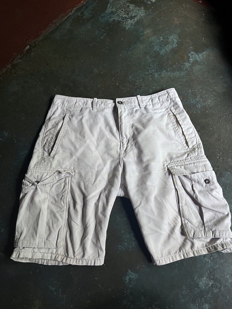Levi Strauss & Co. Off-White Cargo Shorts (Category: Shorts) located in Manila. Submitted by coybns (Listing ID 1467626914, Image 2). Description: - Brand: Levi Strauss & Co. - Color: Off-white / Light beige - Style: Classic utilitarian cargo shorts - Pockets: Dual side cargo pockets with button closures - Material: Sturdy, breathable cotton (great for warm weather) - Features: Belt loops, zip fly, clean waistband, and iconic Levi's leather-style