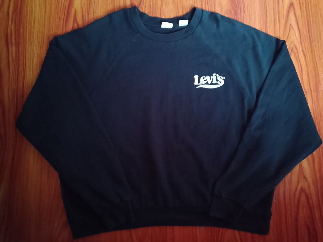Levi's Black Crewneck Sweatshirt Size 1X (Category: Coats, Jackets and Outerwear) located in Manila. Submitted by eveesellinggoods (Listing ID 1467607165, Image 1). Description: - Brand: Levi's - Color: Black with small white retro logo - Size: 1X - Material: Soft fleece lining inside for extra comfort - Design: Raglan sleeves, ribbed collar, cuffs, and hem - Origin: Made in Pakistan - Mode of payment and shipping via Carousell standard options.