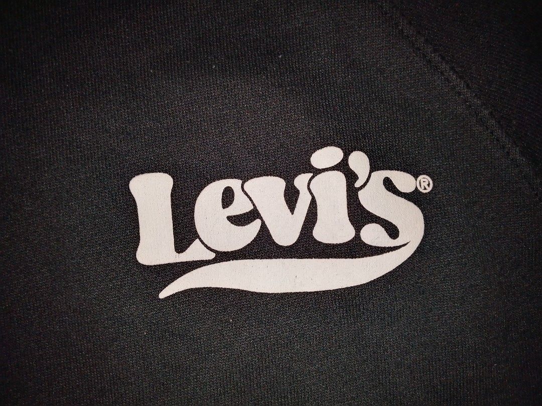 Levi's Black Crewneck Sweatshirt Size 1X (Category: Coats, Jackets and Outerwear) located in Manila. Submitted by eveesellinggoods (Listing ID 1467607165, Image 2). Description: - Brand: Levi's - Color: Black with small white retro logo - Size: 1X - Material: Soft fleece lining inside for extra comfort - Design: Raglan sleeves, ribbed collar, cuffs, and hem - Origin: Made in Pakistan - Mode of payment and shipping via Carousell standard options.