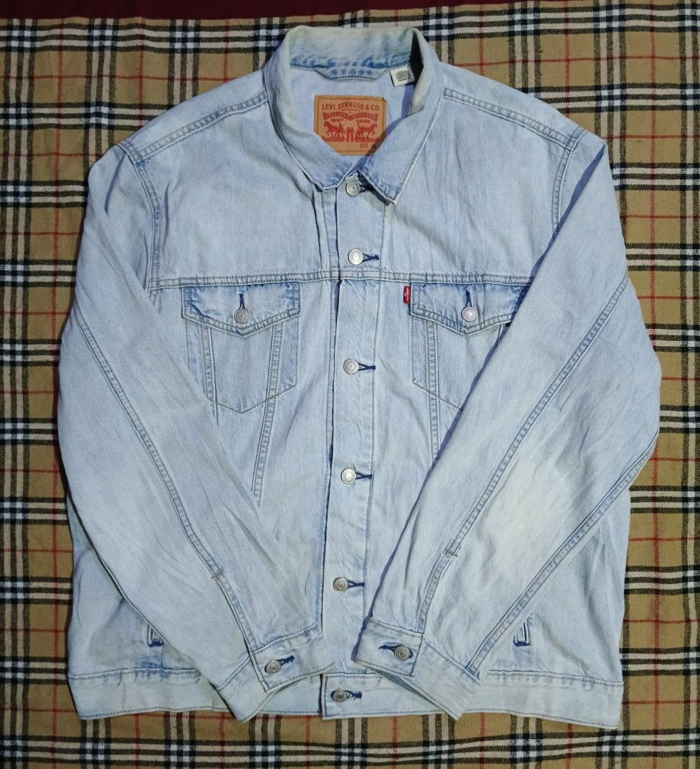 Levi's Light Wash Denim Jacket Size XL (Category: Coats, Jackets and Outerwear) located in General Santos City (Dadiangas). Submitted by freehorse.5f2a61 (Listing ID 1467651896, Image 1). Description: - Brand: Levi's - Style: Classic denim jacket in light wash blue - Size: XL - Features: Button-up front, dual chest pockets, branded metal hardware, and signature red Levi's tab - Origin: Made in Cambodia - Condition: Excellent, ready to wear W 26 L