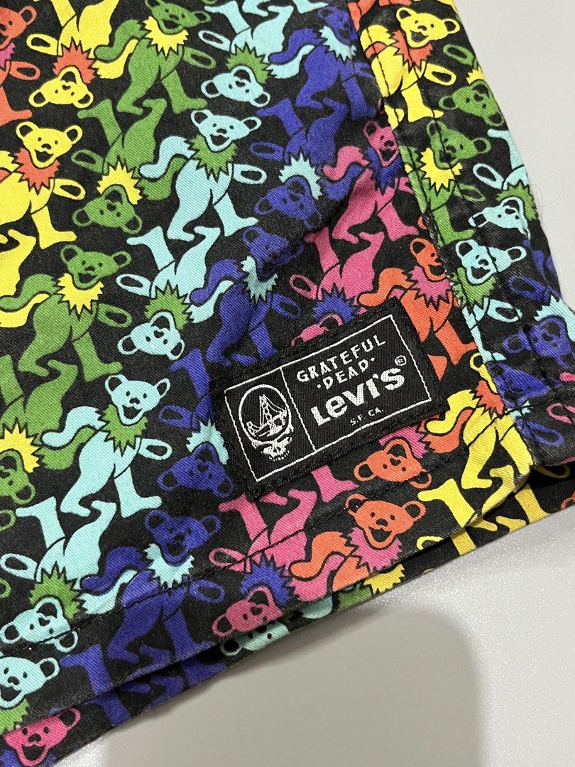 Levi's x Grateful Dead Dancing Bears Shorts (Category: Shorts) located in Manila. Submitted by jorgemabelin2001 (Listing ID 1467760323, Image 3). Description: - Official Levi's x Grateful Dead collaboration shorts - Eye-catching multi-color dancing bears print on black canvas - Comfortable elastic waistband with built-in webbing belt (features dancing skeletons pattern) - Functional back pocket with secure snap button closure - Authentic woven Le