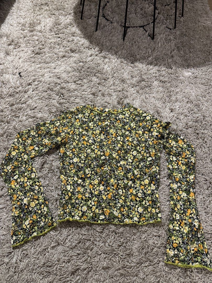 LIBÉ WORKSHOP Floral Print Long Sleeve Top Size S (Category: Longsleeves) located in Caloocan City. Submitted by newcrystal_3b43ba (Listing ID 1467758022, Image 1). Description: - Brand: LIBÉ WORKSHOP - Size: S (tag attached) - Design: Vibrant yellow and green floral print with sheer lace-like fabric - Details: Lettuce trim edges on neckline and hem, trendy flared bell sleeves - Fit: Lightweight, versatile, and perfect for layering.