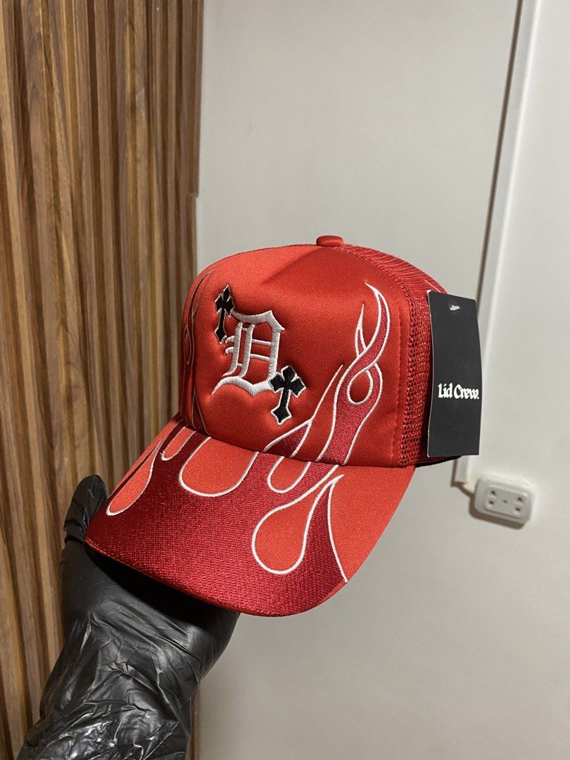 Lid Crew Red Flame Trucker Hat (Category: Caps & Hats) located in Caloocan City. Submitted by heatedcaps4425 (Listing ID 1467800164, Image 3). Description: - Brand: Lid Crew - Condition: Brand new, never worn with tags still attached - Design: Red trucker hat with striking white and black flame embroidery and gothic letter D logo with cross motifs - Features: Breathable mesh back panels and convenient adjustable snapback closure.