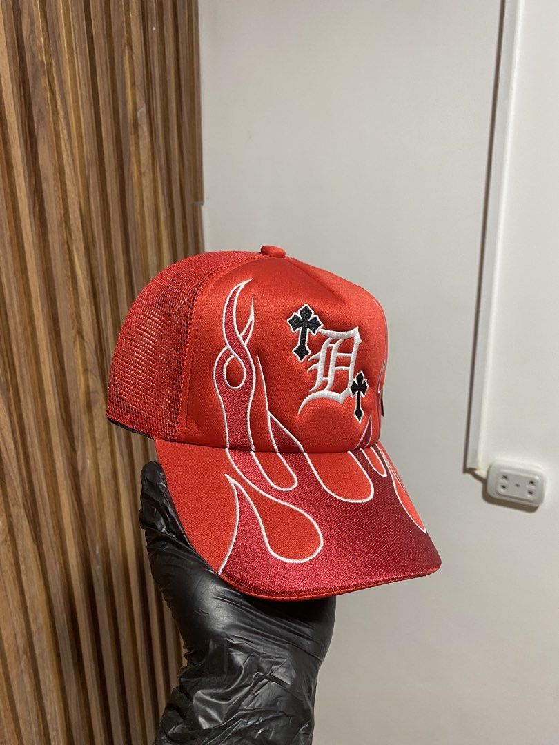 Lid Crew Red Flame Trucker Hat (Category: Caps & Hats) located in Caloocan City. Submitted by heatedcaps4425 (Listing ID 1467800164, Image 2). Description: - Brand: Lid Crew - Condition: Brand new, never worn with tags still attached - Design: Red trucker hat with striking white and black flame embroidery and gothic letter D logo with cross motifs - Features: Breathable mesh back panels and convenient adjustable snapback closure.