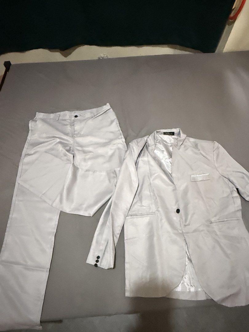 Light Grey Two Piece Suit Set Jacket And Pants (Category: Coats, Jackets and Outerwear) located in Pasig City. Submitted by jointeamqu40916 (Listing ID 1467656428, Image 3). Description: - Color: Light grey with a subtle sheen - Set includes: Single-button blazer and matching trousers - Blazer features: Functional pockets and premium silky inner lining - Fabric: Clean, high-quality material - Occasion: Ideal for formal events, weddings, parties, 