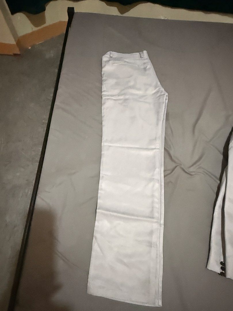 Light Grey Two Piece Suit Set Jacket And Pants (Category: Coats, Jackets and Outerwear) located in Pasig City. Submitted by jointeamqu40916 (Listing ID 1467656428, Image 2). Description: - Color: Light grey with a subtle sheen - Set includes: Single-button blazer and matching trousers - Blazer features: Functional pockets and premium silky inner lining - Fabric: Clean, high-quality material - Occasion: Ideal for formal events, weddings, parties, 