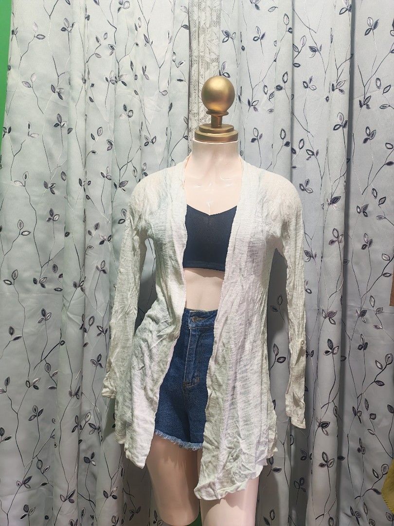 Lightweight open front cardigan in white (Category: Coats, Jackets and Outerwear) located in Caloocan City. Submitted by _misskaye (Listing ID 1467604629, Image 3). Description: - Color: White - Style: Open front cardigan with long sleeves - Fabric: Lightweight and breathable - Fit: Loose-draping design - Versatility: Easy to throw on over tops, shorts, or jeans for effortless layering.