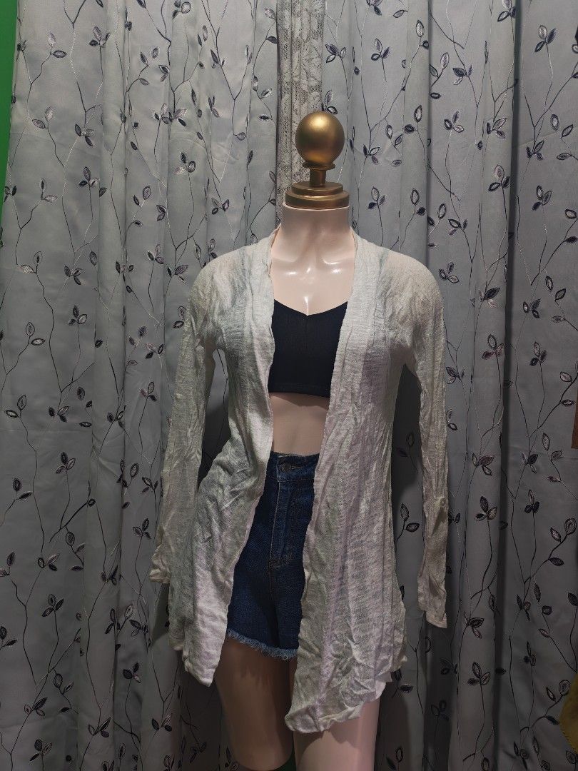 Lightweight open front cardigan in white (Category: Coats, Jackets and Outerwear) located in Caloocan City. Submitted by _misskaye (Listing ID 1467604629, Image 1). Description: - Color: White - Style: Open front cardigan with long sleeves - Fabric: Lightweight and breathable - Fit: Loose-draping design - Versatility: Easy to throw on over tops, shorts, or jeans for effortless layering.
