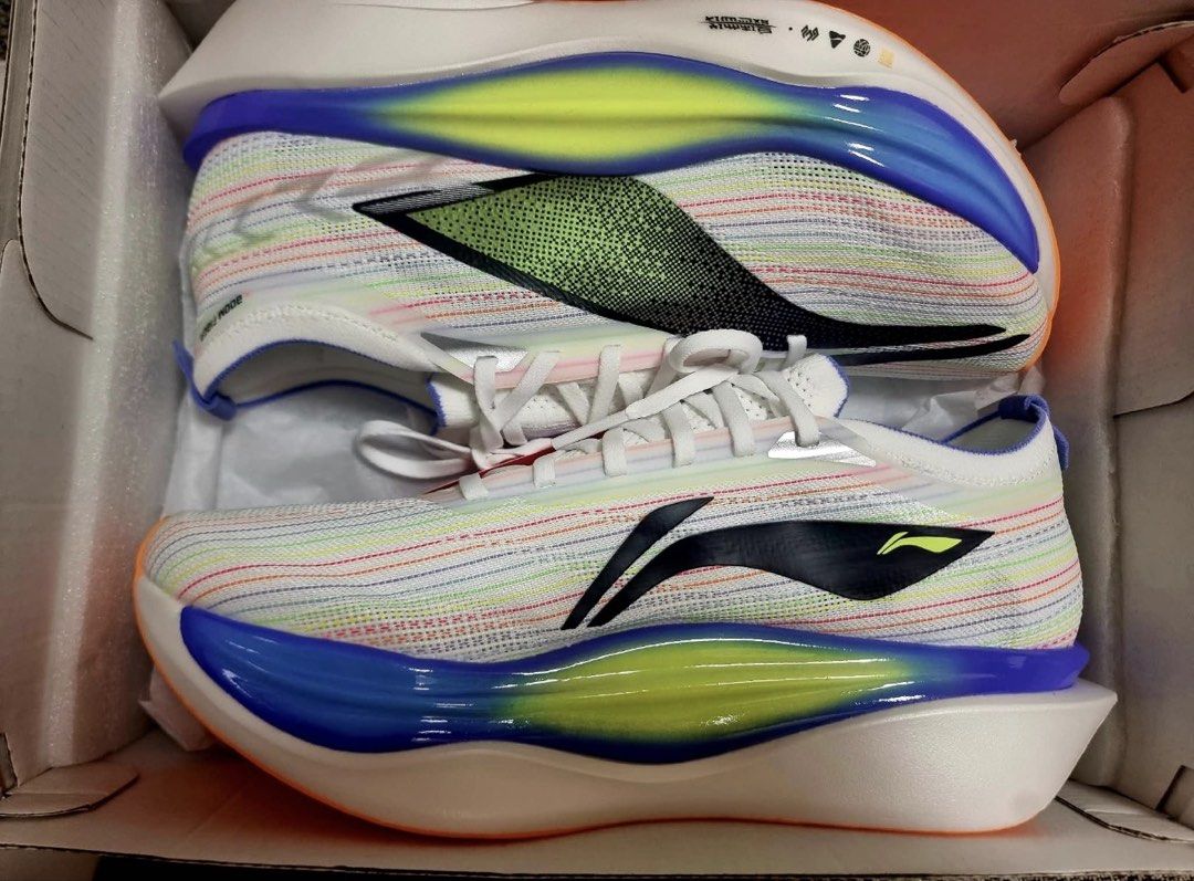 Li-Ning Feidian 3 Elite Running Shoes (Category: Sneakers) located in Manila. Submitted by laura.mnl (Listing ID 1467642221, Image 2). Description: - Brand: Li-Ning - Model: Feidian 3 Elite (Unworn/Brand New) - Color: White with multi-color stripes and bright orange outsole - Type: High-end marathon racing shoes - Technology: Advanced carbon plate and thick, responsive cushioning - Outsole: High-traction rubber for exceptional grip - Inclusions: 