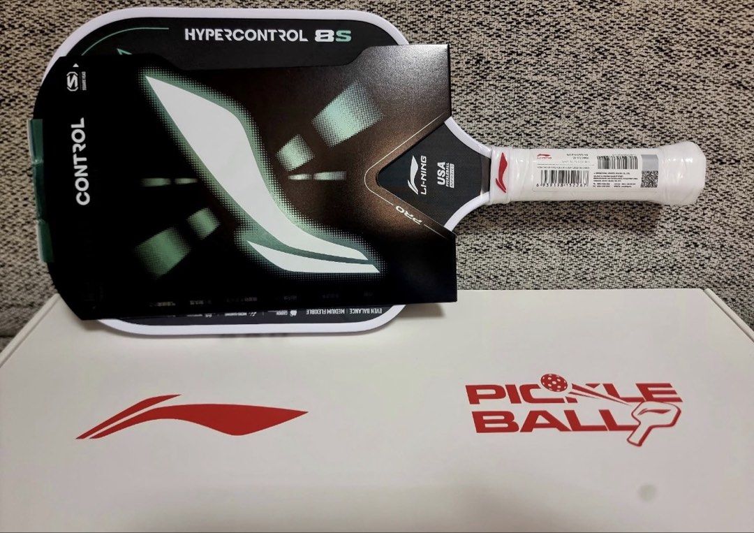 Li-Ning Hypercontrol 8S Pickleball Paddle Carbon Fiber (Category: Racket and Ball Sports) located in Manila. Submitted by laura.mnl (Listing ID 1467641160, Image 1). Description: - Brand: Li-Ning - Model: Hypercontrol 8S - Condition: Brand new, unused in original packaging sleeve and box - Shape: Square head shape for precision play - Material: Premium carbon fiber - Thickness: 14mm - Weight: 218g - Balance & Flex: Even balance with medium flexib