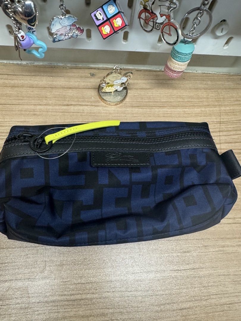 Longchamp Pouch Blue Black Geometric Print (Category: Luxury Bags & Wallets) located in Manila. Submitted by xenasales (Listing ID 1467650552, Image 1). Description: - Authentic Longchamp pouch in a chic dark blue and black geometric pattern - Secure zip-top closure with a trendy neon yellow pull tab accent - Clean dark interior lining complete with a convenient slip pocket - Includes original product tag card - Smooth-gliding zipper and excellen