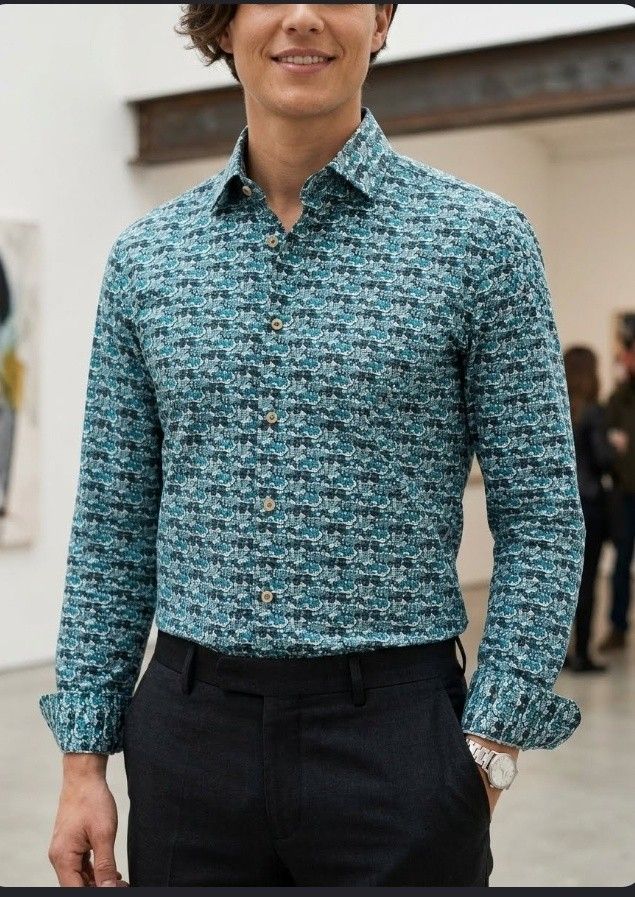 Long-sleeve button-down shirt (Category: Formal Shirts) located in Cabanatuan. Submitted by miss.maia (Listing ID 1467813871, Image 1). Description: This item is a men's long-sleeve button-down shirt featuring an all-over blue and teal graphic/pattern print..