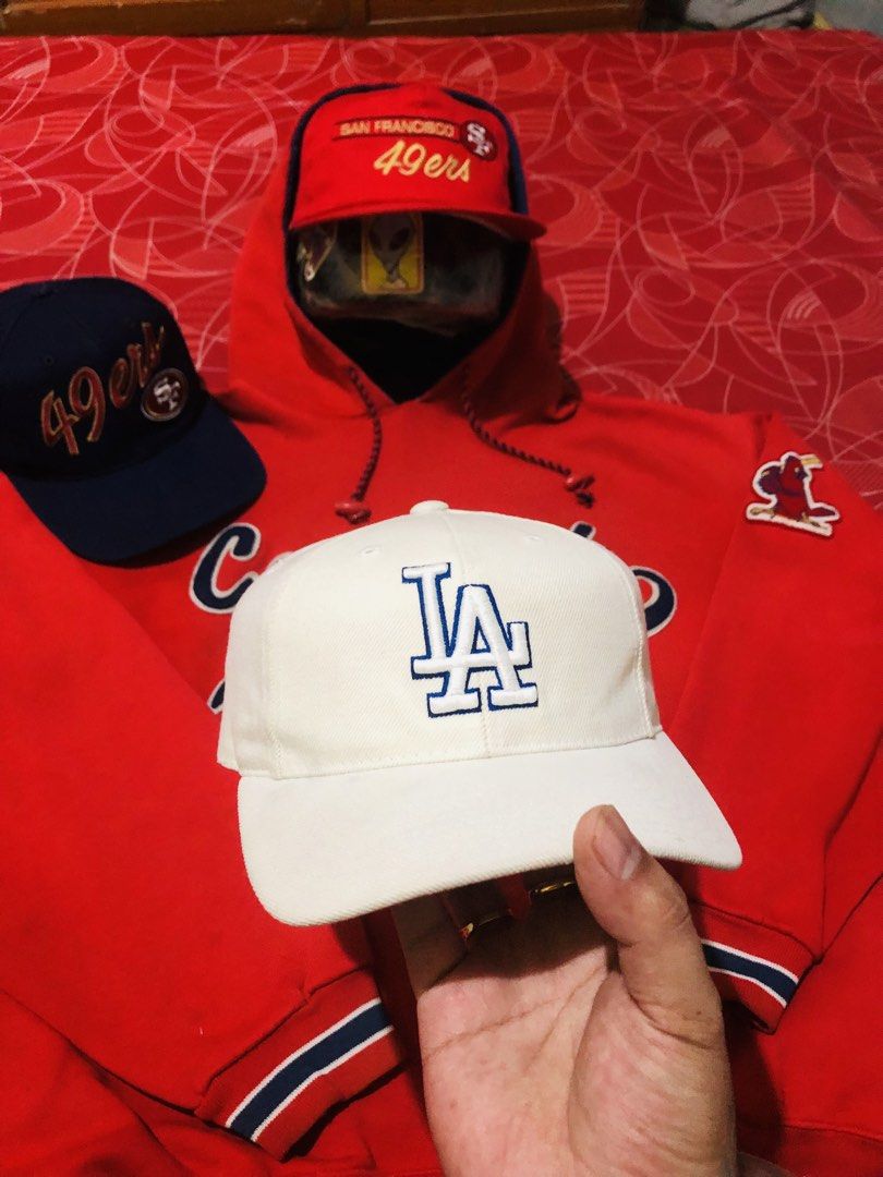 Los Angeles Dodgers MLB Snapback Cap White Blue (Category: Caps & Hats) located in Manila. Submitted by youngmoon_c2e10b (Listing ID 1467813008, Image 1). Description: - Color: Crisp white with a blue embroidered Dodgers logo - Fit: Adjustable plastic snapback closure - Material: 80% acrylic, 20% wool blend - Origin: Manufactured in Bangladesh - Condition: Clean interior lining and structured brim -wool.