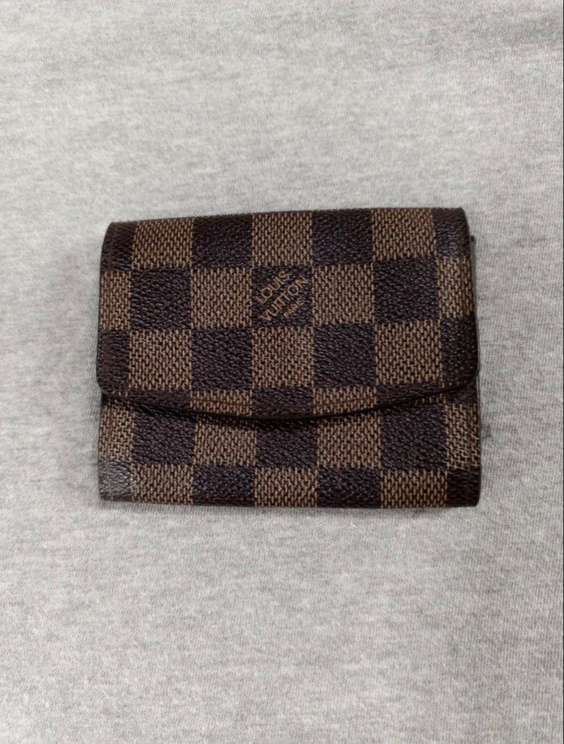 Louis Vuitton Damier Ebene Coin Purse Wallet (Category: Luxury Bags & Wallets) located in Lipa City. Submitted by lenmluxe (Listing ID 1467796313, Image 1). Description: - Iconic Damier Ebene brown checkered canvas - Secure gold-tone hardware snap closure - Compact design ideal for cards and loose change - Model number N61930 stamped in interior pocket - For Self Authentication please -Free Shipping #LvWallet #LvCardHolder #LouisVuitton #LVDamier