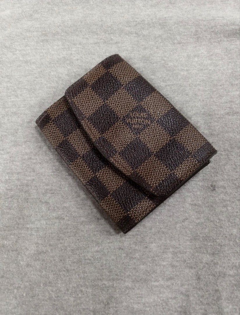 Louis Vuitton Damier Ebene Coin Purse Wallet (Category: Luxury Bags & Wallets) located in Lipa City. Submitted by lenmluxe (Listing ID 1467796313, Image 2). Description: - Iconic Damier Ebene brown checkered canvas - Secure gold-tone hardware snap closure - Compact design ideal for cards and loose change - Model number N61930 stamped in interior pocket - For Self Authentication please -Free Shipping #LvWallet #LvCardHolder #LouisVuitton #LVDamier