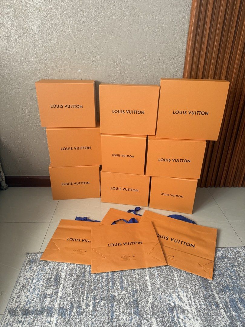 Louis Vuitton Empty Boxes and Paper Bags Bundle (Category: Luxury Bags & Wallets) located in Manila. Submitted by lunacakes (Listing ID 1467658852, Image 2). Description: - 100% Authentic Louis Vuitton packaging materials - Bundle includes multiple rigid orange gift boxes and paper shopping bags with blue handles - Clean, flat bags and sturdy boxes stored with care - Ideal for gift wrapping, home storage, or boutique display setups - Selling ever