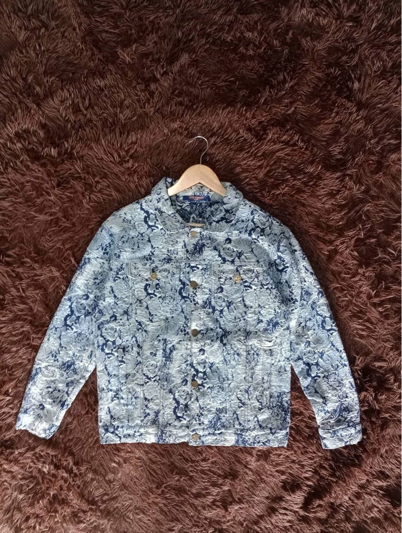 Louis Vuitton Monogram Blue White Floral Denim Jacket (Category: Coats, Jackets and Outerwear) located in Caloocan City. Submitted by martinezvi37712 (Listing ID 1467810186, Image 2). Description: - Brand: Louis Vuitton - Item: Blue & White Patterned Denim Jacket - Details: Monogram leather patch at back hem, branded gold-tone buttons - Features: Blue neck tag with orange LV Paris text, front chest pockets, collar, long sleeves - Condition: Excel