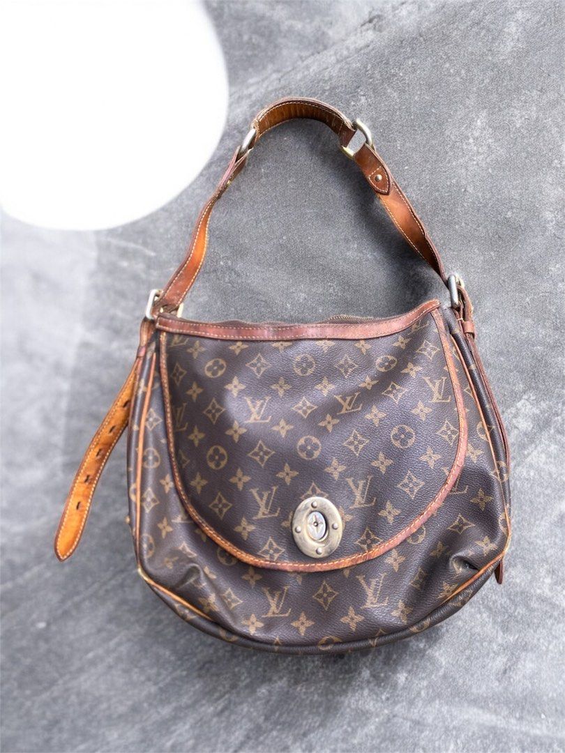 Louis Vuitton Monogram Canvas Shoulder Bag (Category: Luxury Bags & Wallets) located in General Trias. Submitted by mangu_ukay (Listing ID 1467632759, Image 1). Description: - monogra with natural vachetta leather trim - Secure zipper top closure and convenient front flap pocket with twist lock - Adjustable single shoulder strap - Clean interior fabric lining with stamped date code (MD0042) - Condition: Visible patina, strap creasing, and minor w