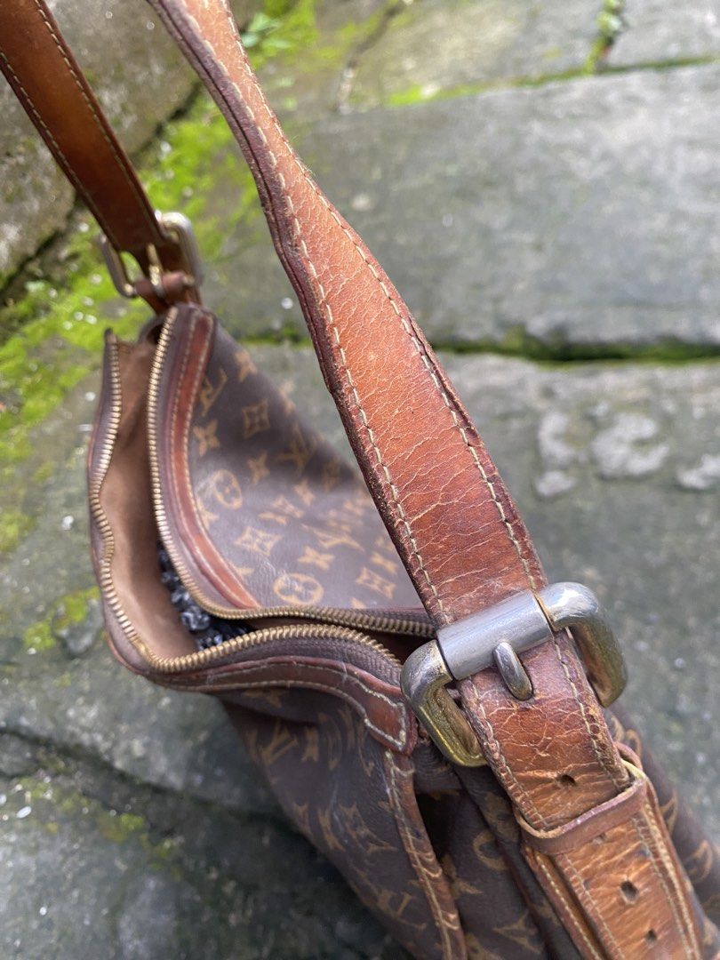 Louis Vuitton Monogram Canvas Shoulder Bag (Category: Luxury Bags & Wallets) located in General Trias. Submitted by mangu_ukay (Listing ID 1467632759, Image 2). Description: - monogra with natural vachetta leather trim - Secure zipper top closure and convenient front flap pocket with twist lock - Adjustable single shoulder strap - Clean interior fabric lining with stamped date code (MD0042) - Condition: Visible patina, strap creasing, and minor w
