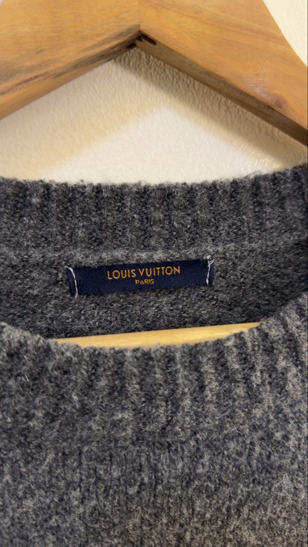 Louis Vuitton Monogram Crewneck Sweater Grey (Category: Coats, Jackets and Outerwear) located in Paranaque City. Submitted by mykapoynton (Listing ID 1467807941, Image 3). Description: Louis Vuitton Monogram Crewneck Sweater Grey - Trendy oversized fit with dark charcoal melange texture - Features a bold LV logo patch on the chest - Stylish blue monogram flower graphics on both sleeves - Classic crewneck with comfortable ribbed hems.