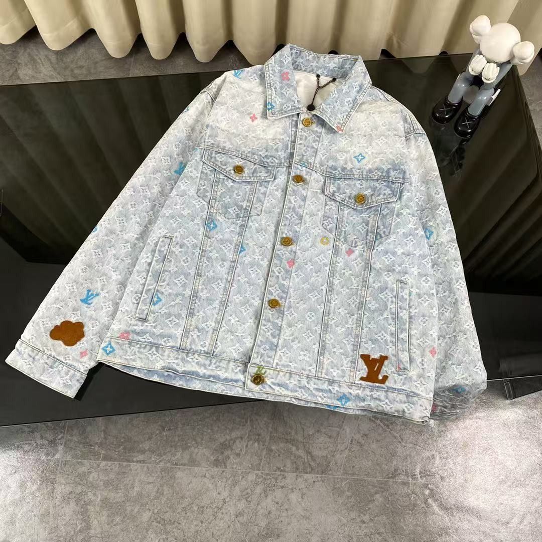 Louis Vuitton Monogram Denim Jacket and Jeans Set (Category: Luxury Apparel) located in Alabat. Submitted by aynunulema58877 (Listing ID 1467700516, Image 3). Description: - Brand new with tags attached - Matching denim set with all-over multicolored monogram print - Light wash denim fabric with gold-tone hardware - Structured trucker jacket with chest pockets - Relaxed fit jeans with classic pocket layout and bold LV patch near the hem.