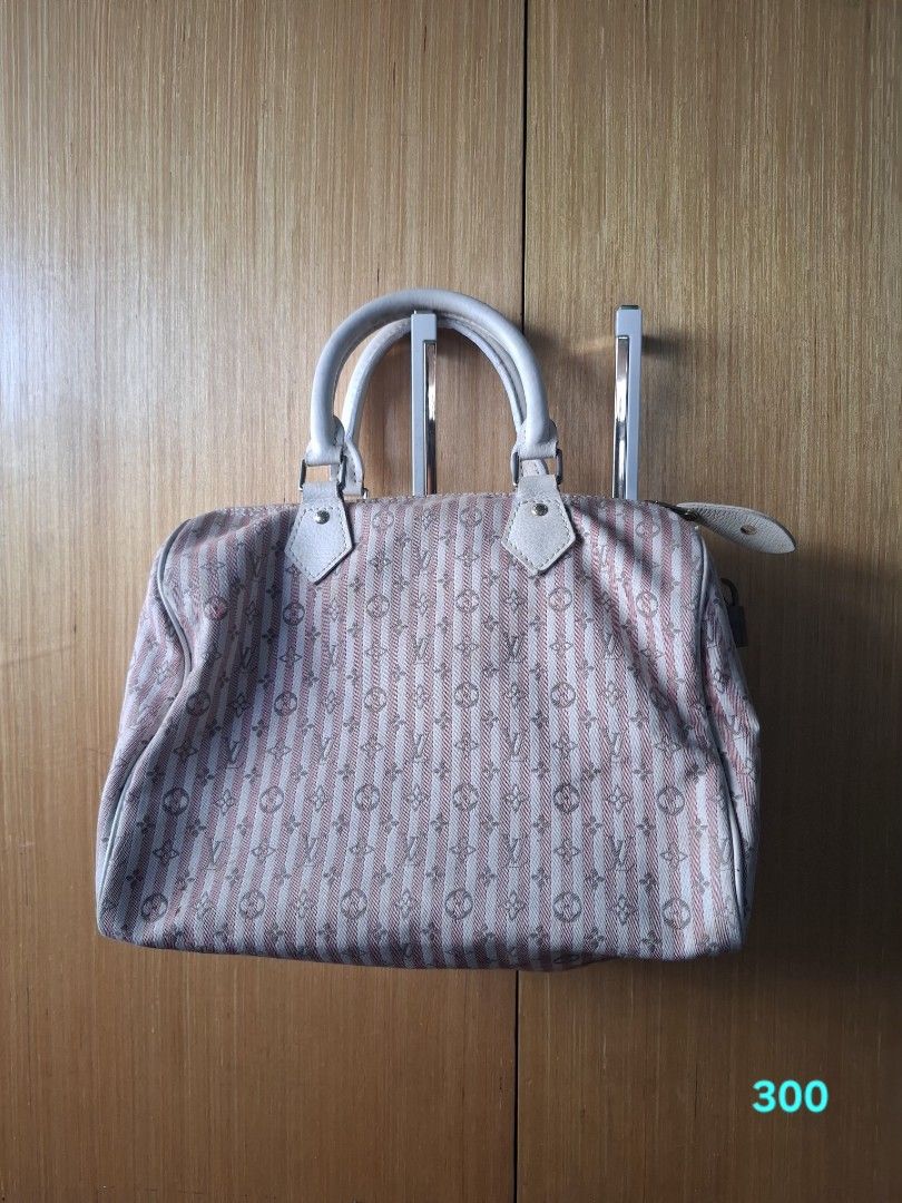 Louis Vuitton Monogram Idylle Speedy Handbag (Category: Luxury Bags & Wallets) located in Pasay City. Submitted by emilia1102 (Listing ID 1467790483, Image 1). Description: - Brand: Louis Vuitton Speedy Handbag - Material: Monogram Idylle canvas in pink and white stripes - Hardware: Gold-tone with hanging side padlock - Closure: Top zipper closure - Interior: Includes standard slip pocket - Condition: fabric exterior with standard handling wear -
