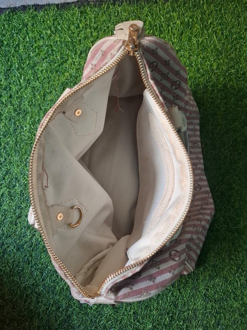 Louis Vuitton Monogram Idylle Speedy Handbag (Category: Luxury Bags & Wallets) located in Pasay City. Submitted by emilia1102 (Listing ID 1467790483, Image 2). Description: - Brand: Louis Vuitton Speedy Handbag - Material: Monogram Idylle canvas in pink and white stripes - Hardware: Gold-tone with hanging side padlock - Closure: Top zipper closure - Interior: Includes standard slip pocket - Condition: fabric exterior with standard handling wear -