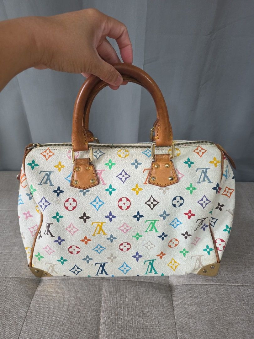 Louis Vuitton Monogram Multicolored Speedy (Category: Luxury Bags & Wallets) located in Binan City. Submitted by karosellescloset (Listing ID 1467663390, Image 3). Description: Louis Vuitton Monogram Multicolore Speedy 30 in White. ​Key features of this model include: ​ ​Material: White coated canvas featuring 33 distinct colors in the LV monogram pattern, with natural cowhide leather (vachetta) trim and top handles. ​Hardware: Gold-tone hardware