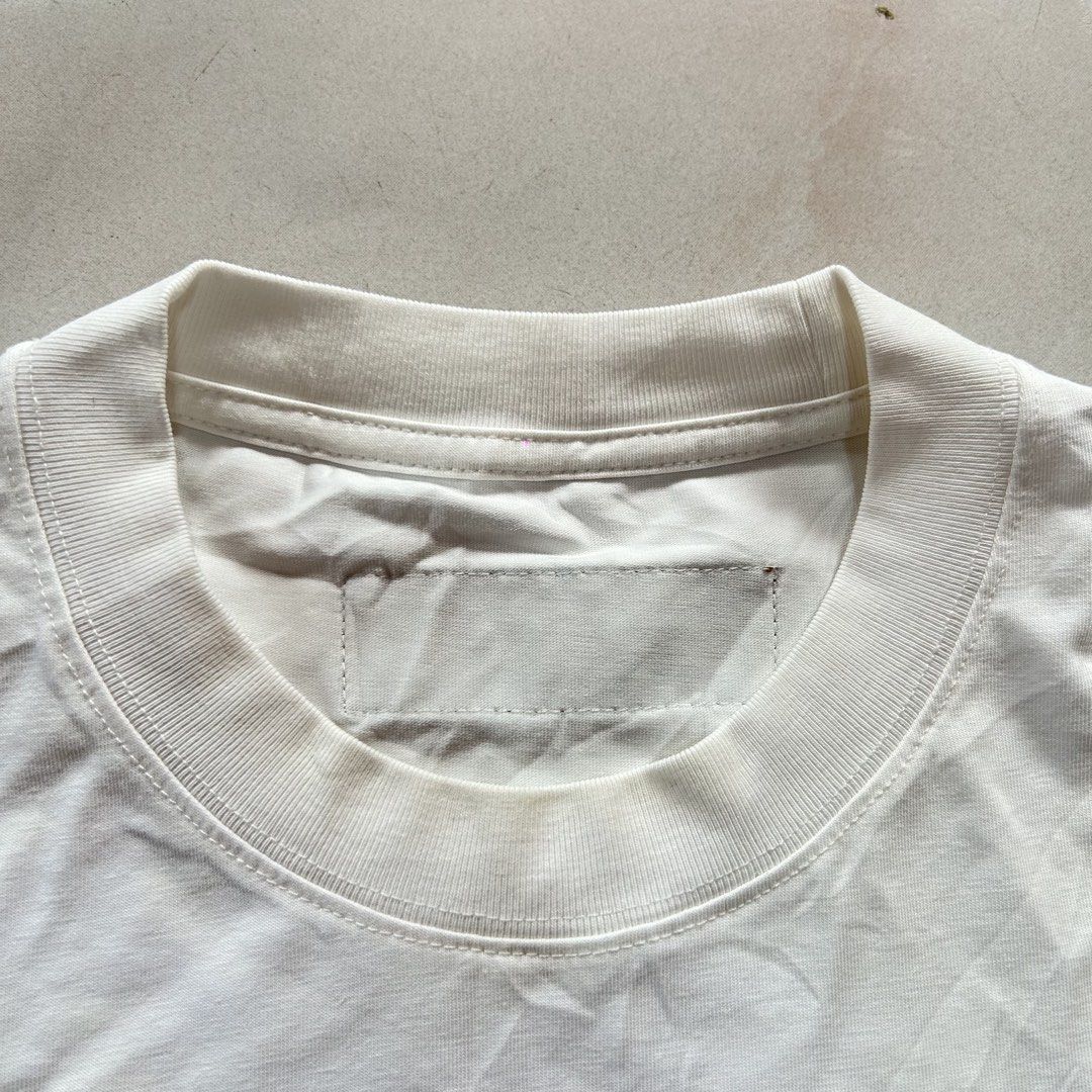 Louis Vuitton White Embroidered Monogram 🔥 (Category: Luxury Apparel) located in Jinoba-an. Submitted by eegiboy (Listing ID 1467650385, Image 2). Description: - Color: White - Material: Comfortable cotton - Design: Large embroidered LV monogram on the back and small LV logo patch on the front chest - Details: Brown leather-look tag at the back collar - Fit: Regular fit with classic crew neck and short sleeves Wts: Lv shirt 🔥 No tags lang po pa