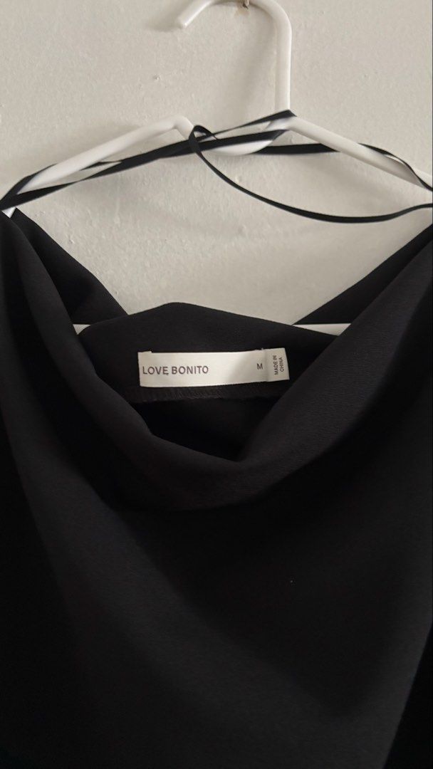Love Bonito Amala Draped Top (Category: Blouses) located in Mandaluyong City. Submitted by planetplsrsclub (Listing ID 1467627525, Image 3). Description: - Worn twice, like new - Relaxed draped top with a boatneck and short sleeves - Elegant look for casual dates or occasions - Size M - Black - Selling because black doesn’t suit me.