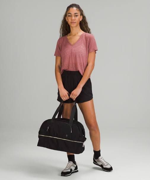 Lululemon Black Gym Duffel Bag (Category: Sling Bags) located in Iloilo. Submitted by fromthebins.ilo2 (Listing ID 1467750751, Image 2). Description: Black Lululemon duffel bag with sturdy shoulder straps and an adjustable crossbody strap. Silver-tone hardware and front zip pocket with the signature logo emblem. Roomy main compartment with a wraparound zipper. Bottom panel shows scuff marks and light wear from everyday use. Great size for workout