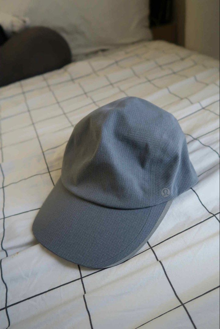 Lululemon Cap Size S/M Grey (Category: Caps & Hats) located in Manila. Submitted by gentlewind_62f064 (Listing ID 1467676105, Image 1). Description: - Brand: Lululemon - Color: Grey - Size: S/M - Material: Unique grid texture throughout - Closure: Adjustable strap with buckle - Comfort: Built-in interior sweatband - Details: Subtle printed Lululemon omega logo on the lower left panel - Condition: Excellent / Like new - Meet-ups or shipping availa