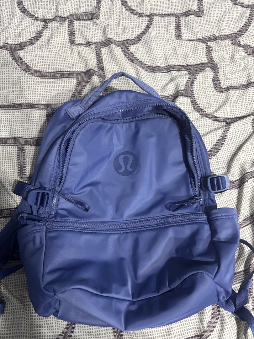 Lululemon Everyday Backpack Purple (Category: Backpacks) located in Tarlac. Submitted by aldrin328 (Listing ID 1467738491, Image 2). Description: - Brand: Lululemon - Color: Vibrant Purple - Material: Clean, durable nylon - Compartments: Multiple exterior zip compartments - Interior Storage: Mesh interior pocket and separate padded zip sleeve - Comfort: Padded top handle and fully adjustable straps - Ideal Use: Great daily carry for work, school,