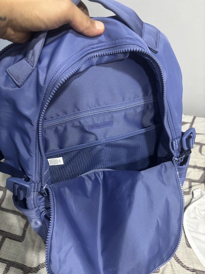 Lululemon Everyday Backpack Purple (Category: Backpacks) located in Tarlac. Submitted by aldrin328 (Listing ID 1467738491, Image 3). Description: - Brand: Lululemon - Color: Vibrant Purple - Material: Clean, durable nylon - Compartments: Multiple exterior zip compartments - Interior Storage: Mesh interior pocket and separate padded zip sleeve - Comfort: Padded top handle and fully adjustable straps - Ideal Use: Great daily carry for work, school,