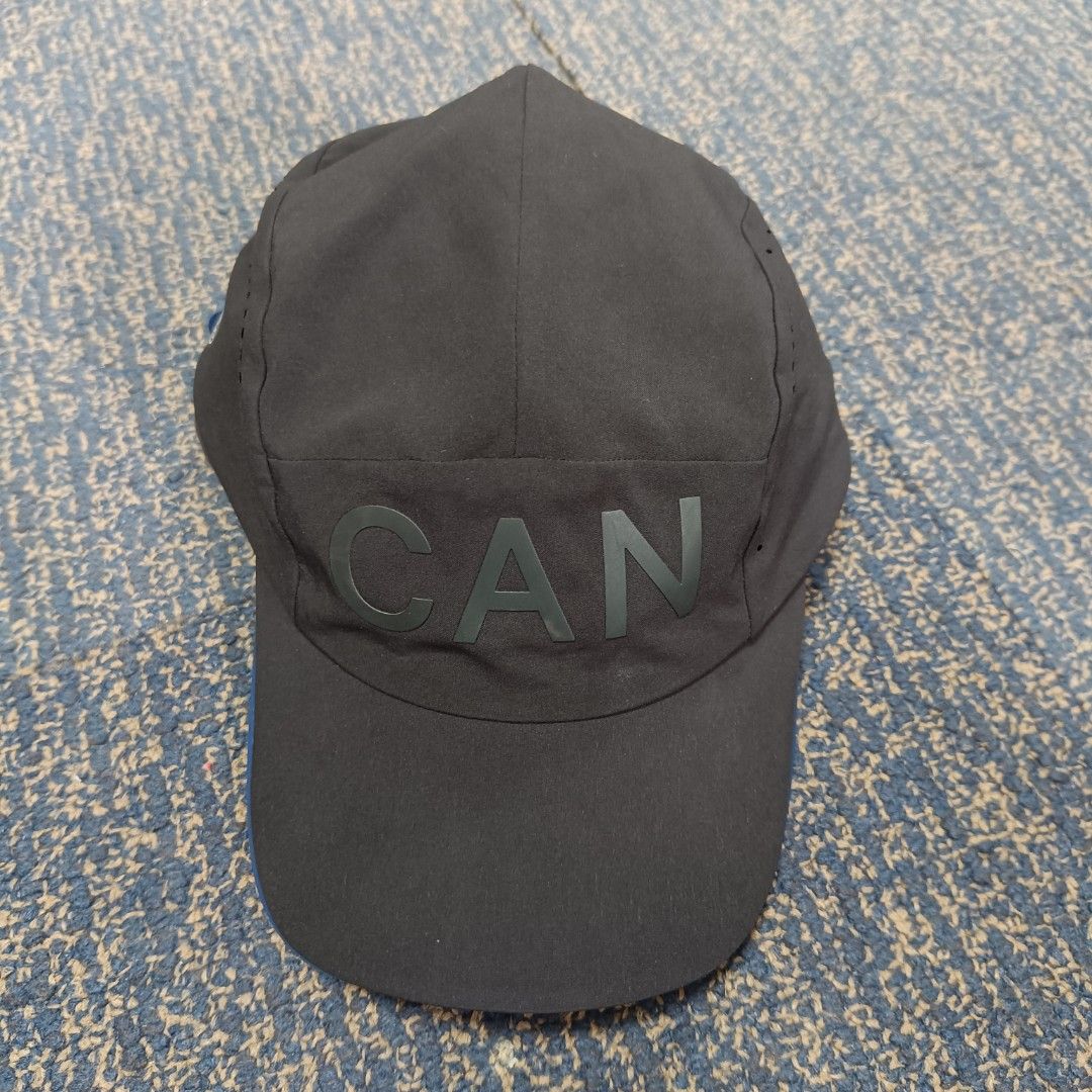 Lululemon Team Canada Olympic Cap Hat Black (Category: Caps & Hats) located in Angeles City. Submitted by thriftilious.ph (Listing ID 1467647637, Image 1). Description: - Authentic Lululemon Team Canada cap in classic black - Features bold "CAN" lettering on the front - Side panels equipped with laser-cut ventilation perforations for breathability - Iconic Lululemon omega logo on one side and Team Canada maple leaf with Olympic rings on the other