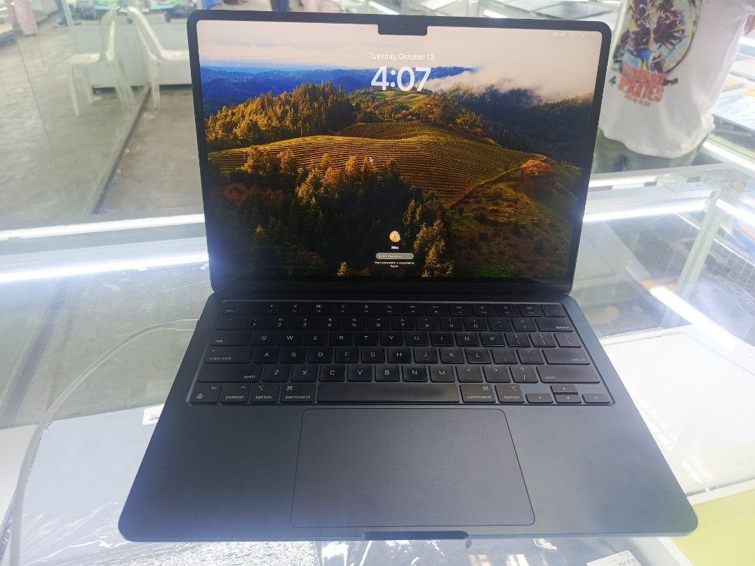 MacBook Air M2 2022 Midnight (Category: Laptops & Notebooks) located in Manila. Submitted by norodinamr15076 (Listing ID 1467728291, Image 3). Description: - Model: MacBook Air M2 (Midnight) - OS: macOS Sonoma - Battery Health: 87% capacity (205 cycle count) - Condition: Clean screen and keyboard, minor wear from regular handling - Performance: Excellent, solid machine for daily tasks and writing unit inclusion charger with pouch and Free Ms offi