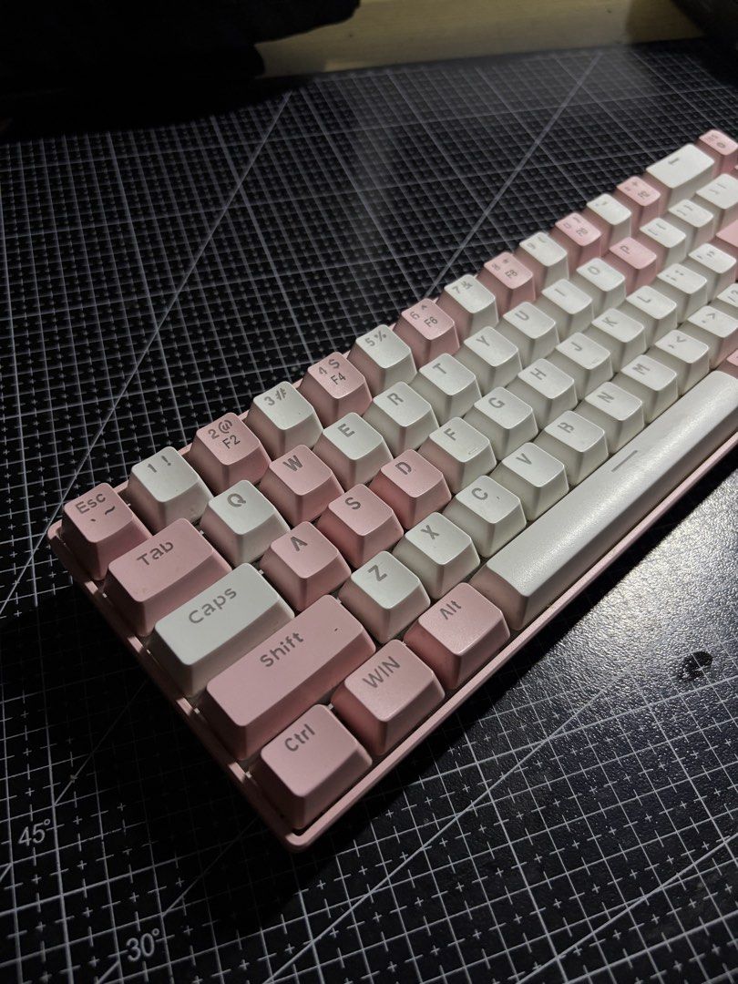 MageGee MK-Box 68-Key Pink Mechanical Keyboard (Category: Computer Keyboard) located in Manila. Submitted by thriftilaok (Listing ID 1467727400, Image 2). Description: - Model: MageGee MK-Box Mechanical Keyboard - Colorway: Cute Dual-Tone Pink and White - Layout: Compact 68-key with dedicated arrow keys and navigation cluster - Switches: Clicky Blue mechanical switches - Connectivity: Wired USB - Condition: Fully functional, adjustable feet intac