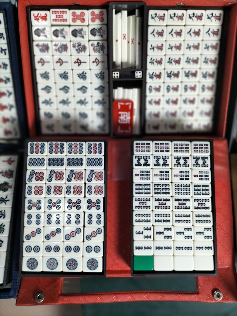 Mahjong Set with case Japanese (Category: Board Games & Puzzles) located in Cainta. Submitted by banzvi73 (Listing ID 1467639546, Image 3). Description: - Features traditional Chinese characters and suits on tiles - Conveniently organized across three colorful cases that open flat for easy access - Perfect for game nights and gatherings.