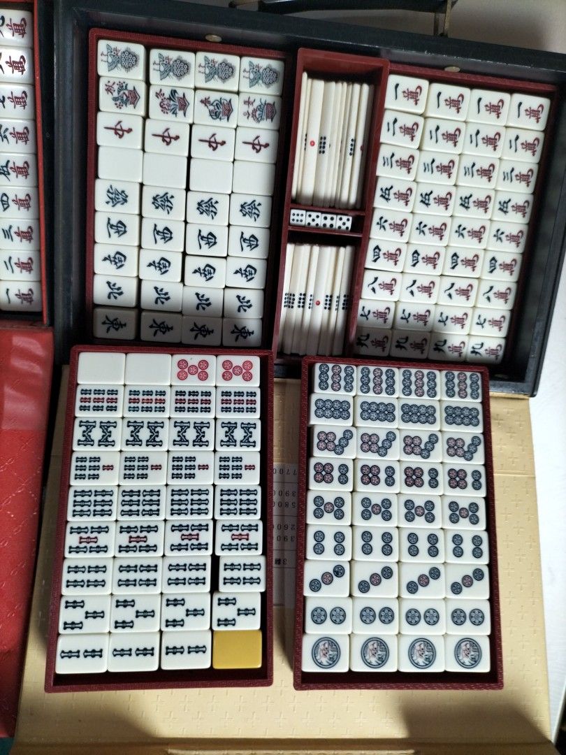 Mahjong Set with case Japanese (Category: Board Games & Puzzles) located in Cainta. Submitted by banzvi73 (Listing ID 1467639546, Image 2). Description: - Features traditional Chinese characters and suits on tiles - Conveniently organized across three colorful cases that open flat for easy access - Perfect for game nights and gatherings.