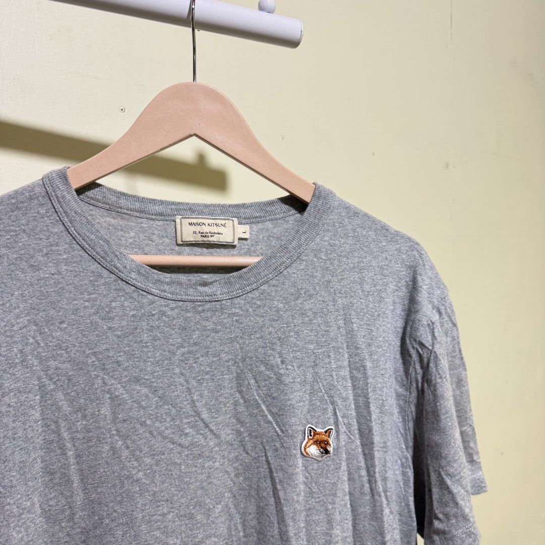 Maison Kitsune Grey Fox Head Patch T-Shirt (Category: Tshirts & Polo Shirts ) located in Bago City. Submitted by g___shop (Listing ID 1467735546, Image 3). Description: - Brand: Maison Kitsune - Color: Grey - Size: Large (Classic fit) - Material: 100% cotton for everyday comfort - Details: Signature embroidered fox head patch, Paris address inner tag - Condition: Clean, smoke-free home.