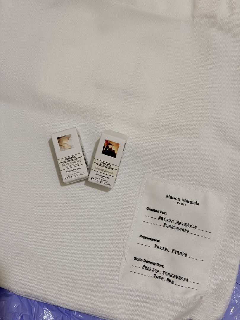 Maison Margiela Replica Fragrances Tote Bag & Samples (Category: Tote Bags) located in Manila. Submitted by scimihx (Listing ID 1464635413, Image 3). Description: - Includes 2 Replica fragrance samples: Lazy Sunday Morning & Chasing sunsets - Ideal set for experiencing Maison Margiela scents - Bag features a printed label on the front pocket.