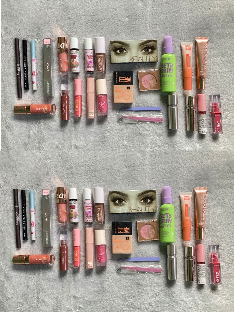 Makeup bundle (Take All) (Category: Makeup) located in Rizal. Submitted by sheeraay (Listing ID 1467708225, Image 2). Description: - 25-piece massive makeup bundle - Includes popular brands: Maybelline Fit Me, Huda Beauty, Dazzle Me, Happy Skin, and more - Product assortment: Liquid contours, water tints, setting sprays, eyeshadows, primers, lip glosses, eyeliner pencils, tweezers, and highlighters - Ideal as a starter kit or to expand your curre