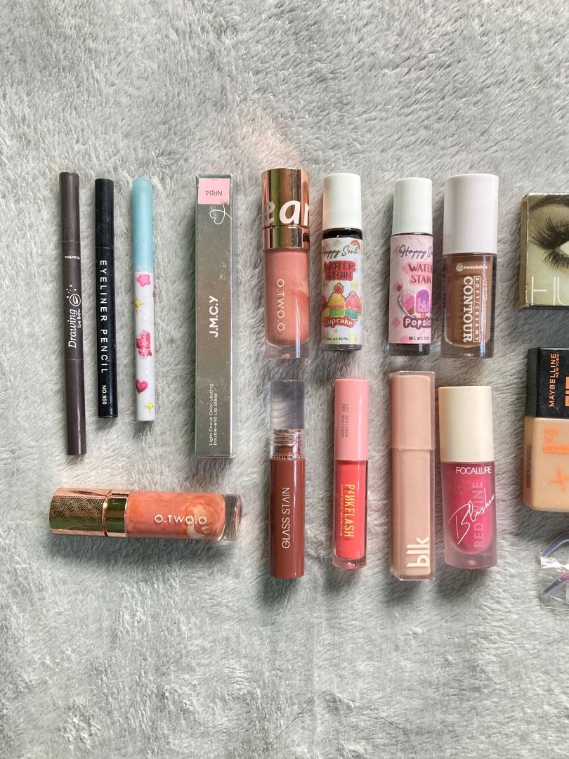 Makeup bundle (Take All) (Category: Makeup) located in Rizal. Submitted by sheeraay (Listing ID 1467708225, Image 3). Description: - 25-piece massive makeup bundle - Includes popular brands: Maybelline Fit Me, Huda Beauty, Dazzle Me, Happy Skin, and more - Product assortment: Liquid contours, water tints, setting sprays, eyeshadows, primers, lip glosses, eyeliner pencils, tweezers, and highlighters - Ideal as a starter kit or to expand your curre