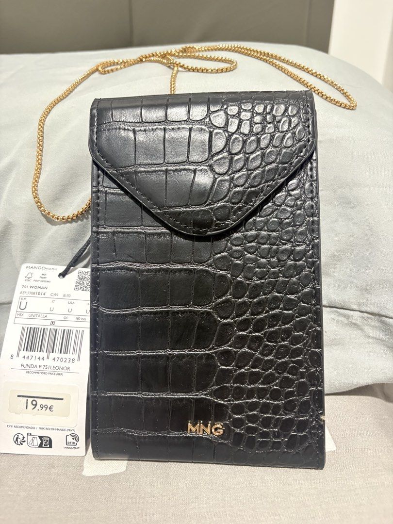 Mango Black Croc Effect Phone Pouch Crossbody Bag (Category: Cross-body Bags) located in Quezon City. Submitted by everything99_ (Listing ID 1467774764, Image 1). Description: - Brand: Mango (Original store tag attached, Model: FUNDA P 75ILEONOR) - Color & Finish: Sleek black with a trendy crocodile texture - Hardware: Elegant gold-tone accents including the front MNG logo and slim chain strap - Closure: Secure flap with a magnetic snap button - 
