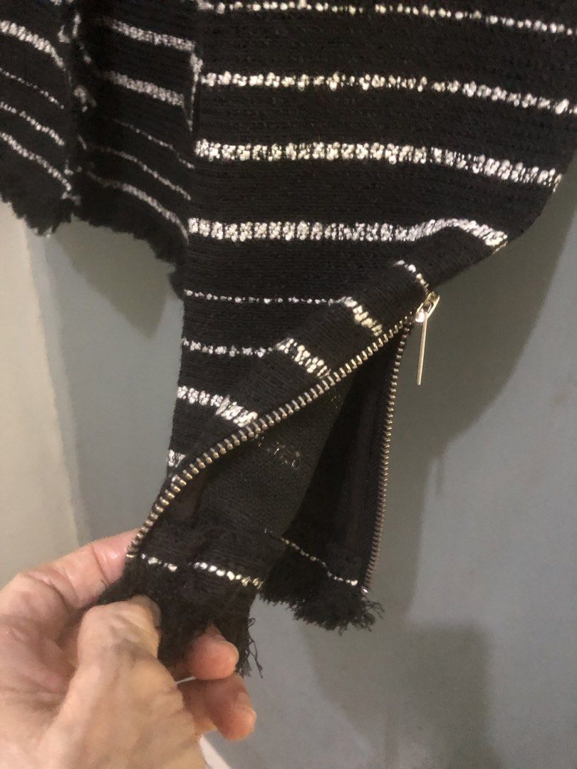 Mango Black White Striped Tweed Jacket Blazer Size S (Category: Coats, Jackets and Outerwear) located in Quezon City. Submitted by unique2shop (Listing ID 1467689737, Image 3). Description: - Brand: Mango - Style: Black and white striped tweed jacket with open front and structured lapel - Details: Zipper cuffs and functional side pockets - Accents: Trendy fringe trim along the neckline, hem, and cuffs - Fabric: Textured knit, great for layering c