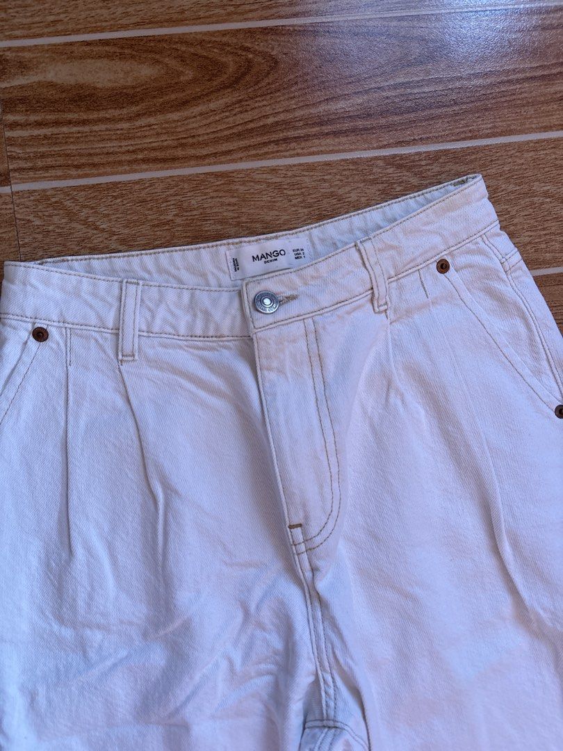 Mango Denim White High Waist Pants (Category: Jeans) located in Manila. Submitted by _foryou (Listing ID 1467672597, Image 3). Description: - Brand: Mango - Size: EUR 34 / USA 2 - Material/Origin: Made in Pakistan - Fit: High-waisted with a stylish pleated front - Details: Contrast stitching, button closure with zip fly, classic 5-pocket style - Condition: Clean, casual look, perfect for pairing with crop tops or t-shirts.