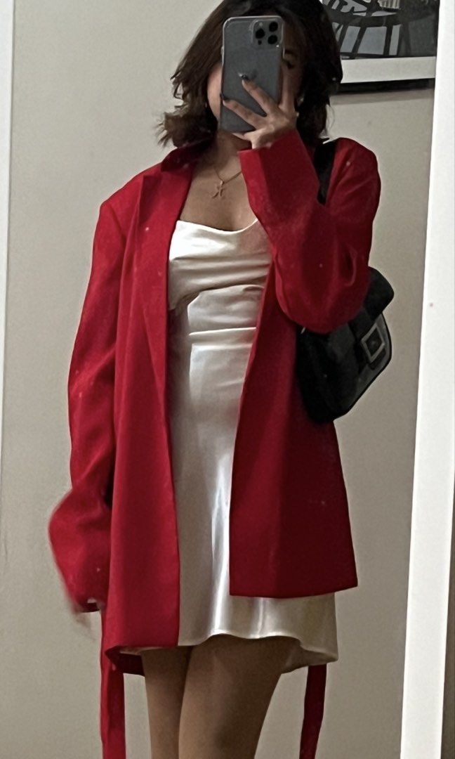 MANGO Red Blazer Size S (Category: Coats, Jackets and Outerwear) located in Lipa City. Submitted by chiechums (Listing ID 1467640158, Image 1). Description: - Brand: MNG - Size: EUR/USA Small - Color: Bright red (great for a pop of color) - Material: Lightweight fabric with a slight drape - Design: Lapels, long sleeves, and built-in tie belt straps at the sides - Condition: Excellent, no major flaws spotted.