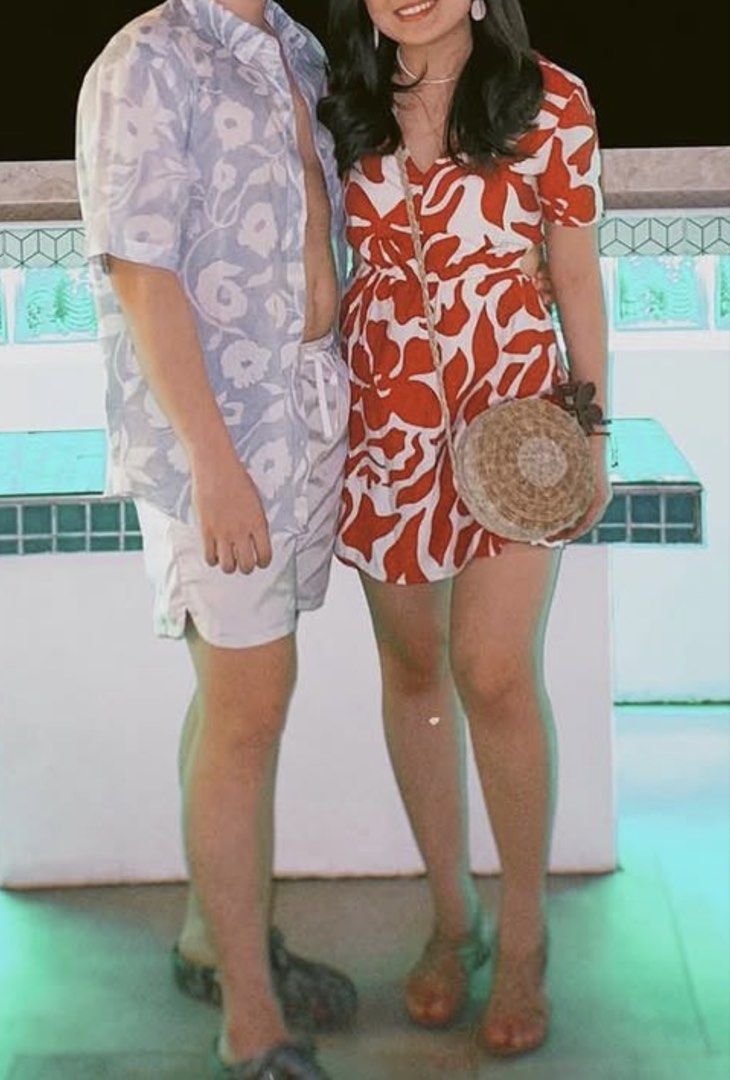 Mango Red Floral Print Cutout Romper Size XS (Category: Rompers) located in Manila. Submitted by m.south (Listing ID 1467736077, Image 2). Description: - Brand: Mango - Size: XS - Design: Red and off-white floral pattern with V-neck and short sleeves - Features: Waist cutouts with adjustable drawstring tie - Material: Lightweight fabric, ideal for warm weather and vacations - Condition: Worn a few times, washed, and well-maintained.