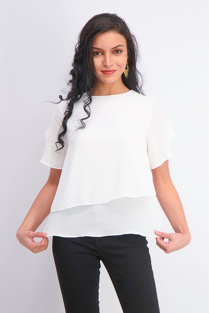 Mango White Layered Chiffon Top (Category: Blouses) located in Muntinlupa City. Submitted by caroucella (Listing ID 1467744643, Image 1). Description: - White - Short sleeve top with a trendy layers - Lightweight, flowy, and very comfortable and flattering Perfect for both casual outings and workwear; easy to style with jeans or skirts Fits S- M breezy and roomy.